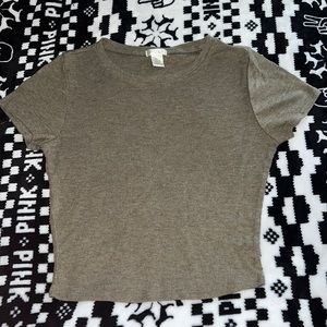 medium half crop shirt, may fit more as a small